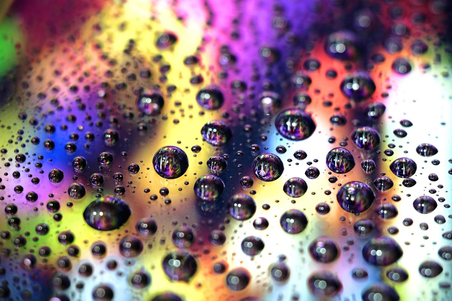 Macro image of droplets on shiny surfae. photo