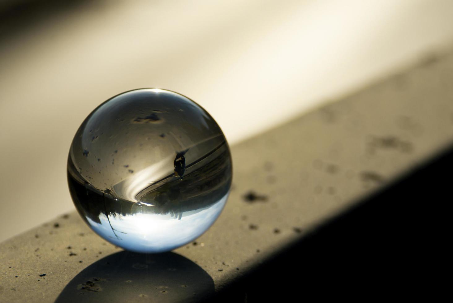 Landscape seen through the lens ball. photo