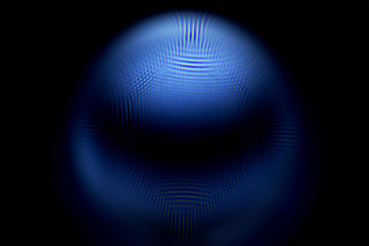 An abstract sphere with a blurry pattern isolated on black background. photo