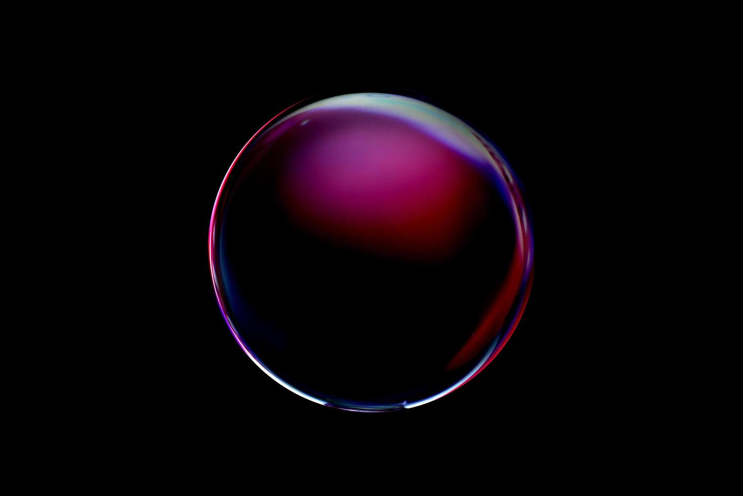 An abstract sphere with a blurry pattern isolated on black background. photo