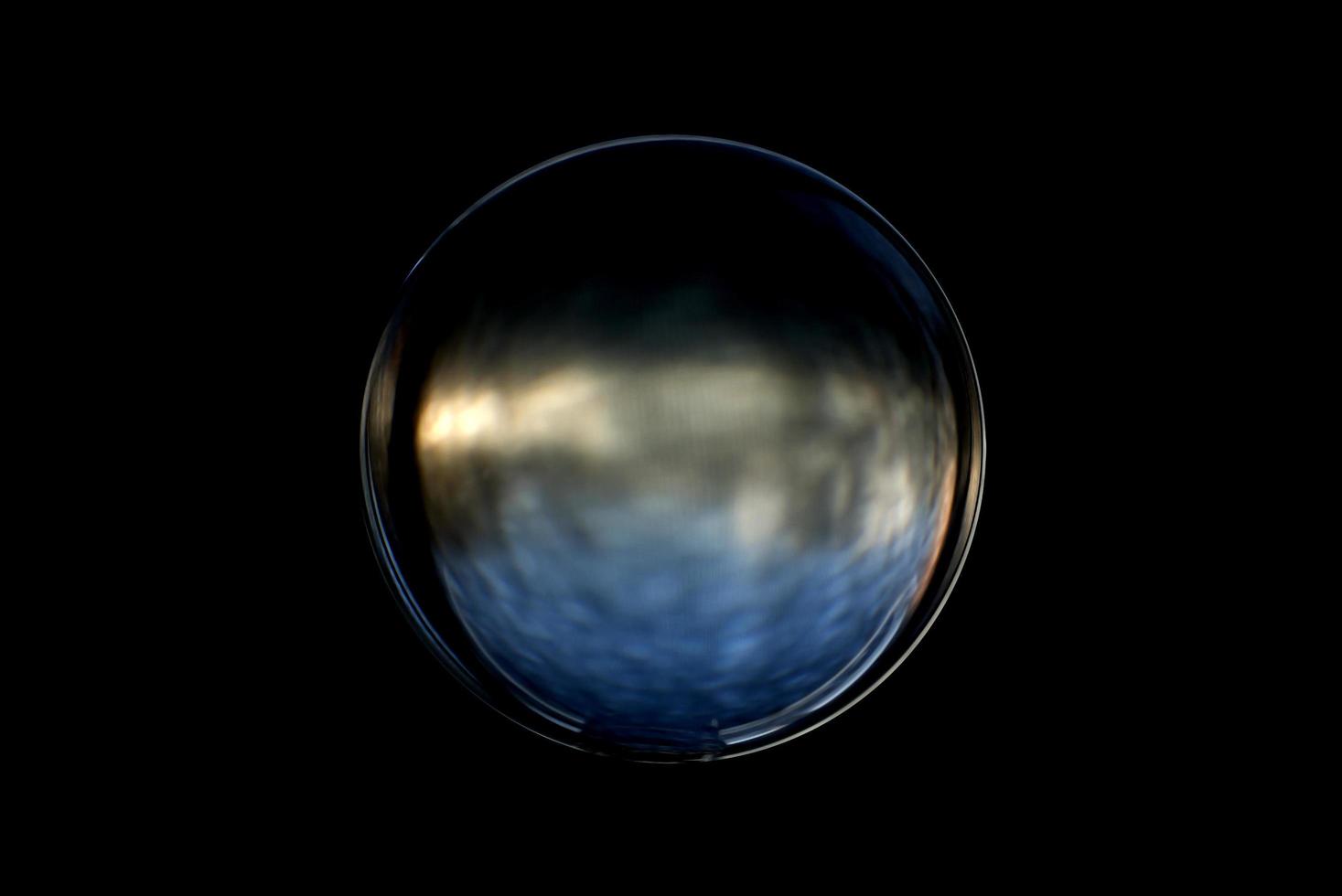 An abstract sphere with a blurry pattern isolated on black background. photo