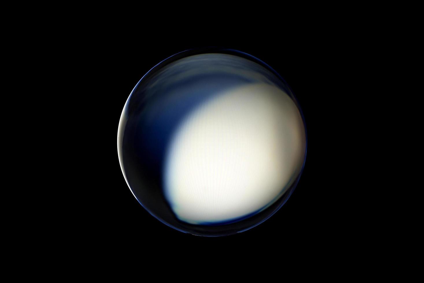 An abstract sphere with a blurry pattern isolated on black background. photo