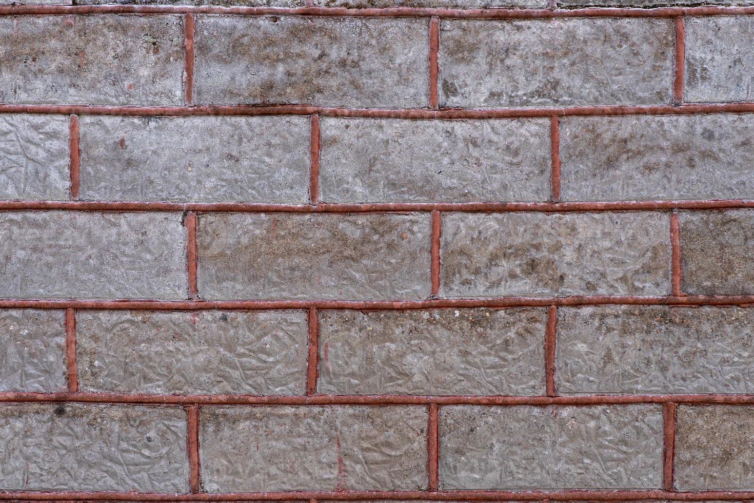Old brick wall with red filling photo