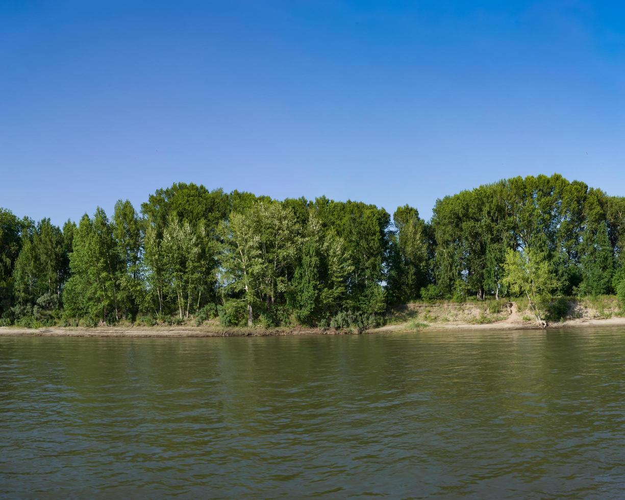 Natural landscape with the coastline of the river photo