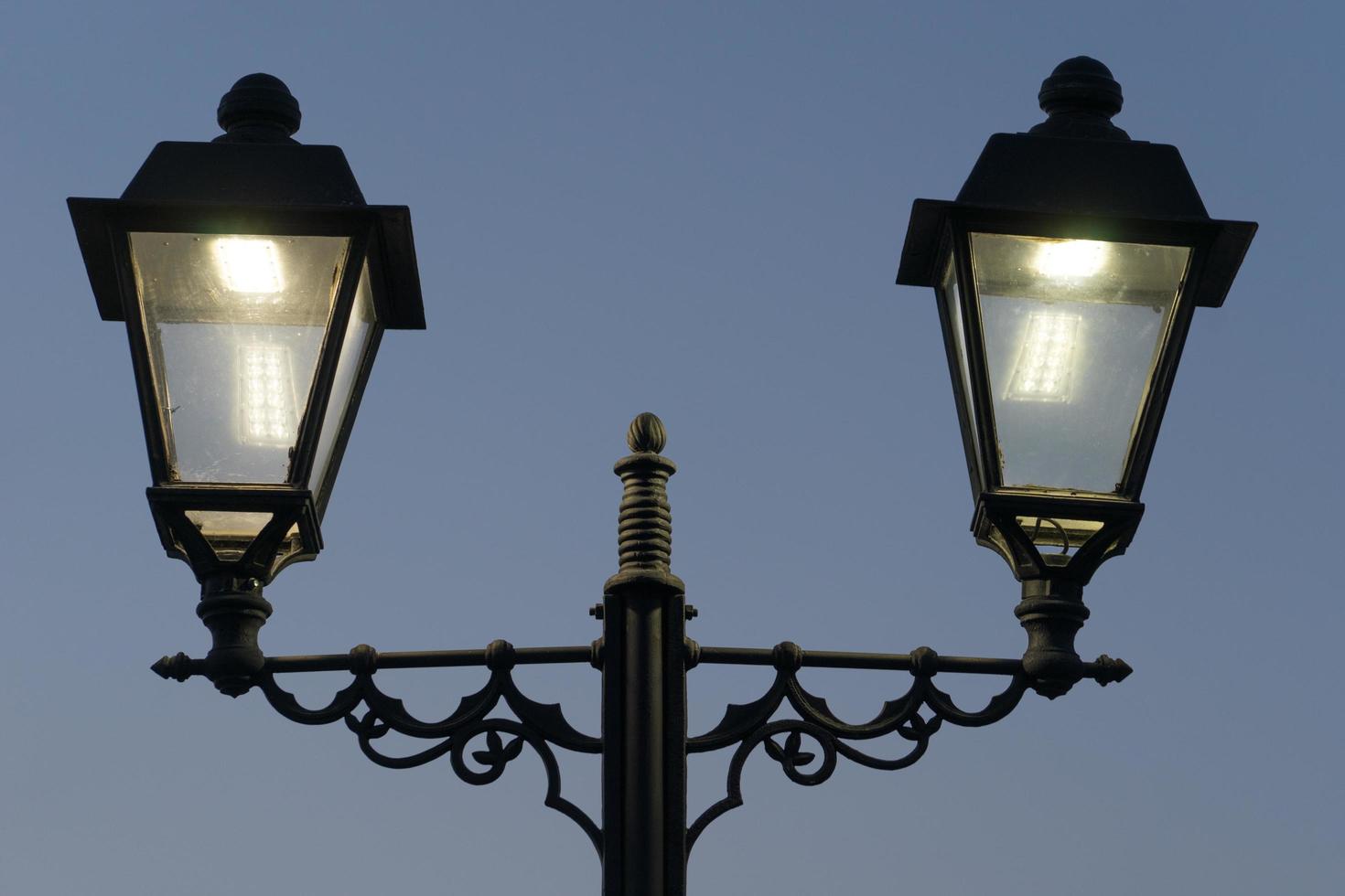 electric lights in antique style with Sochi's promenade in the evening photo
