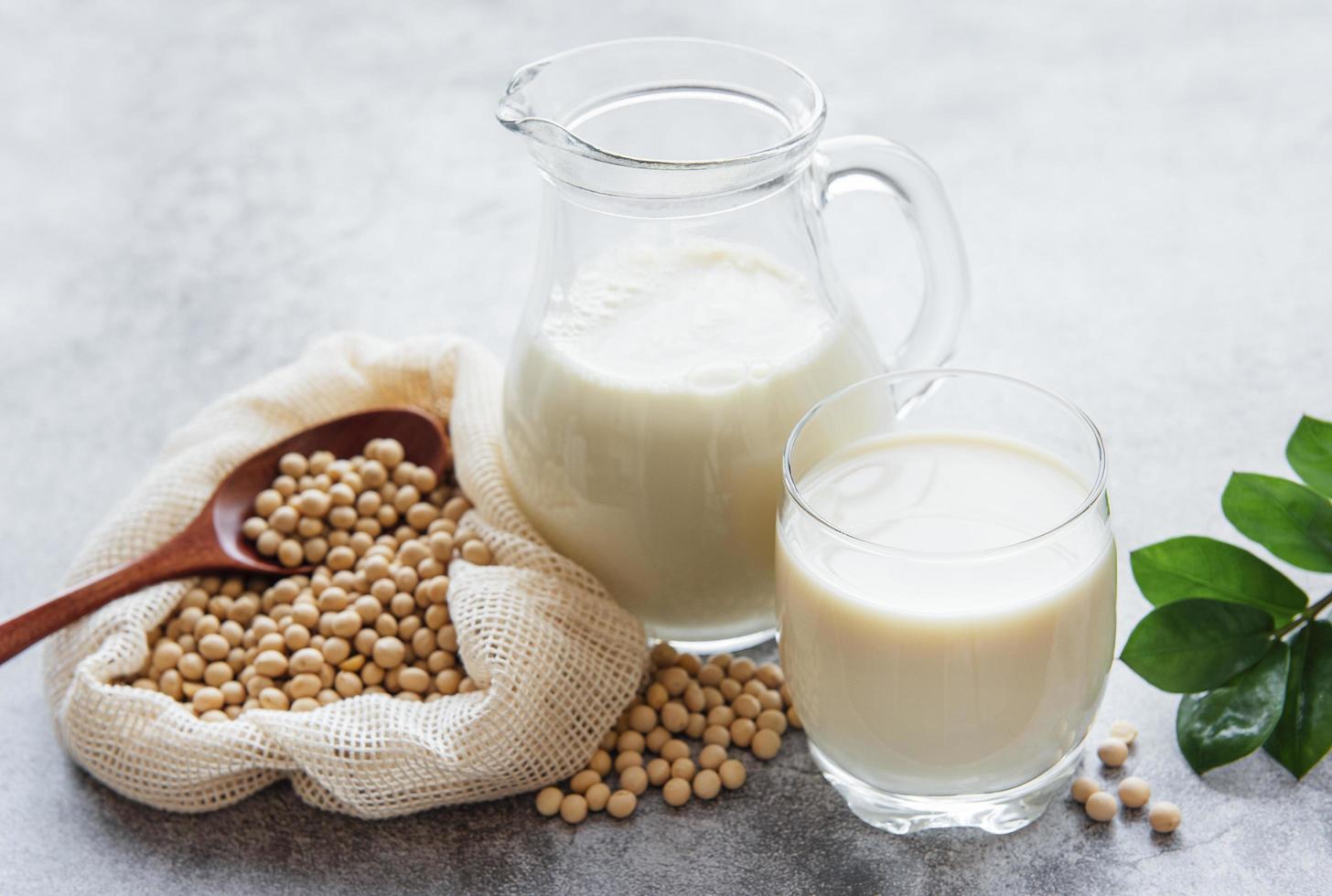 Soy milk and soy on the table photo