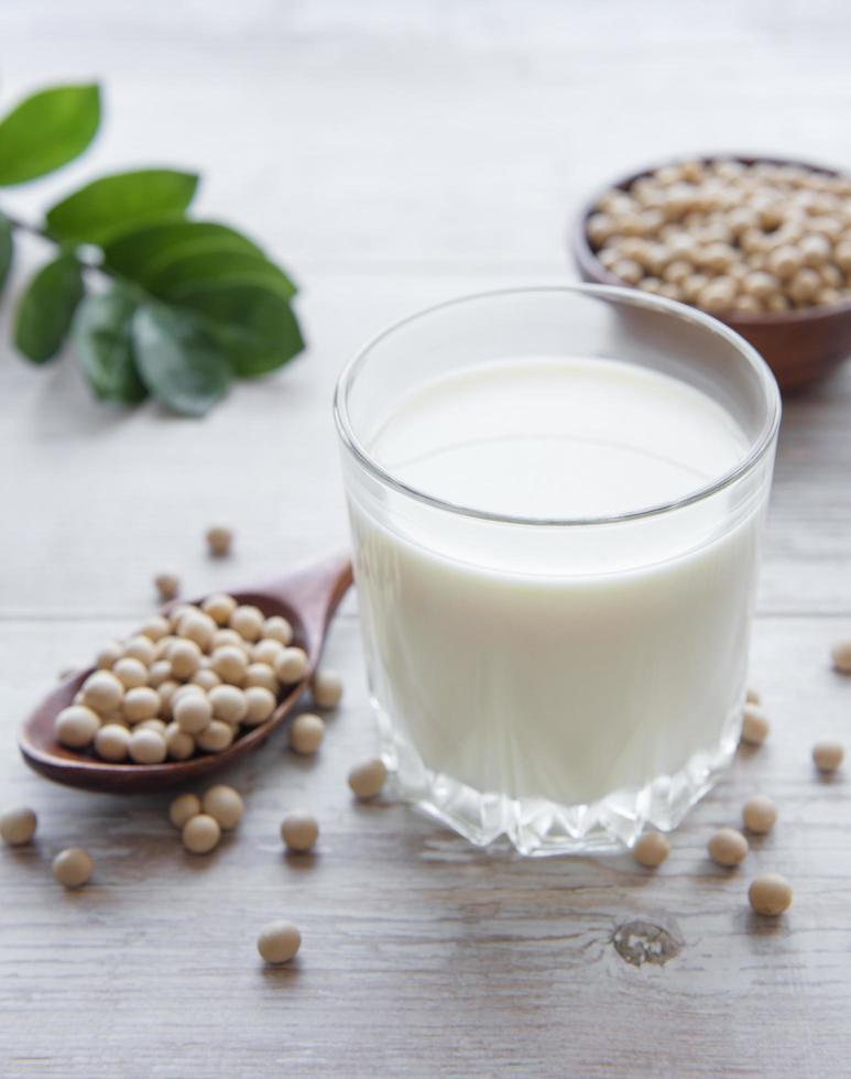 Soy milk and soy on the table photo