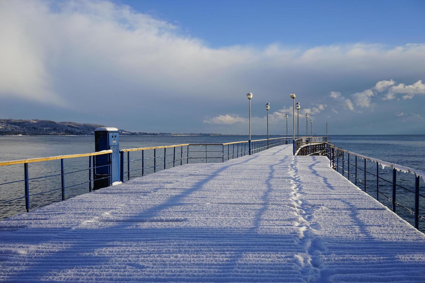 Marine boat dock in a sub-tropical country under a layer of snow photo