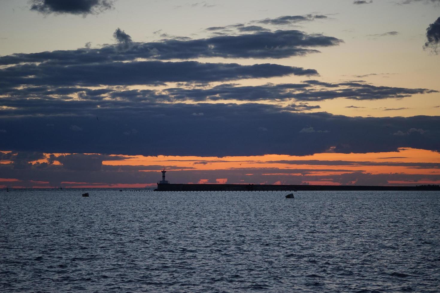 Sunset in the sea Bay on the payroll of the dark sky photo