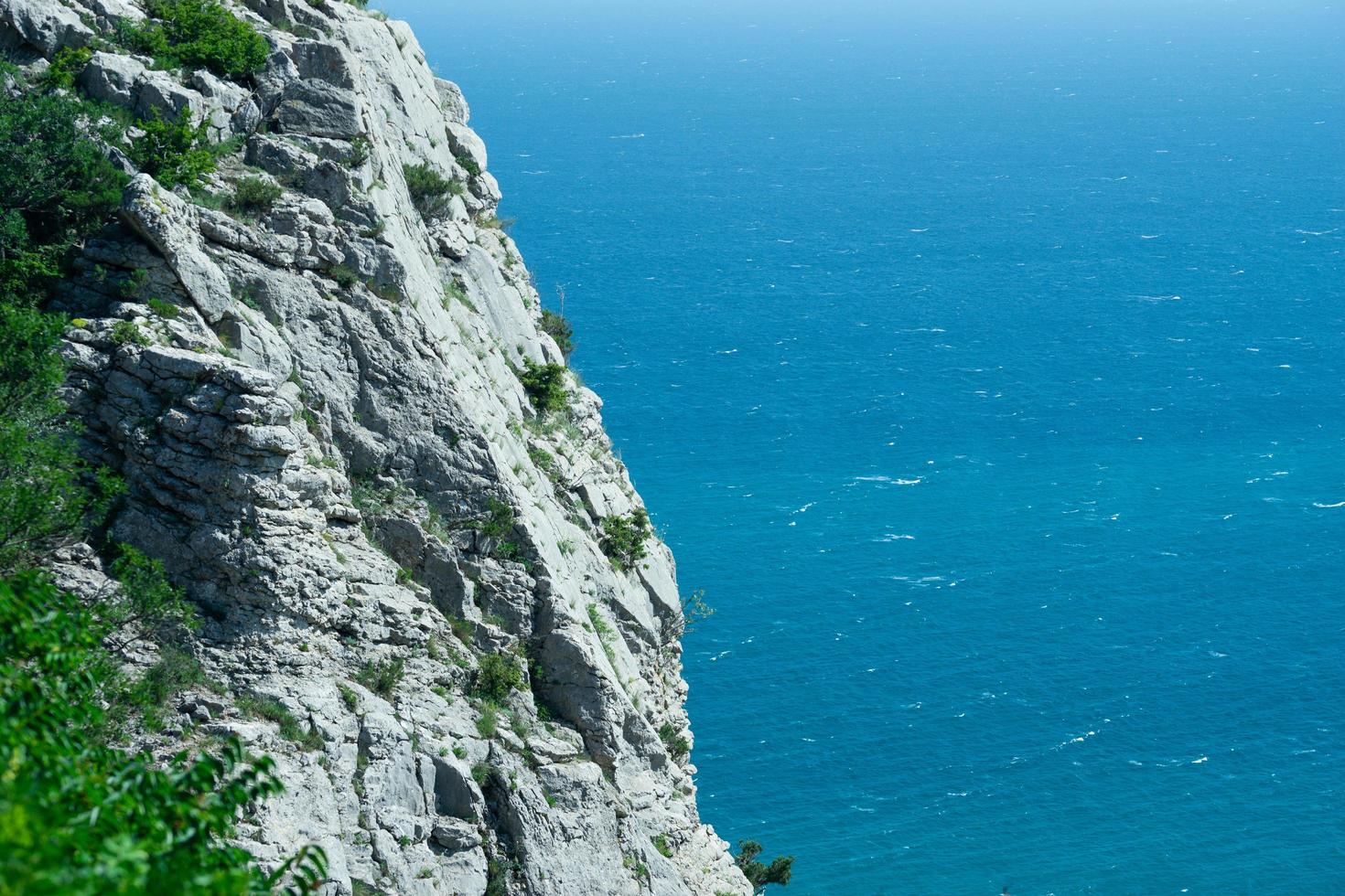 Landscape with a rock on the background of the sea photo