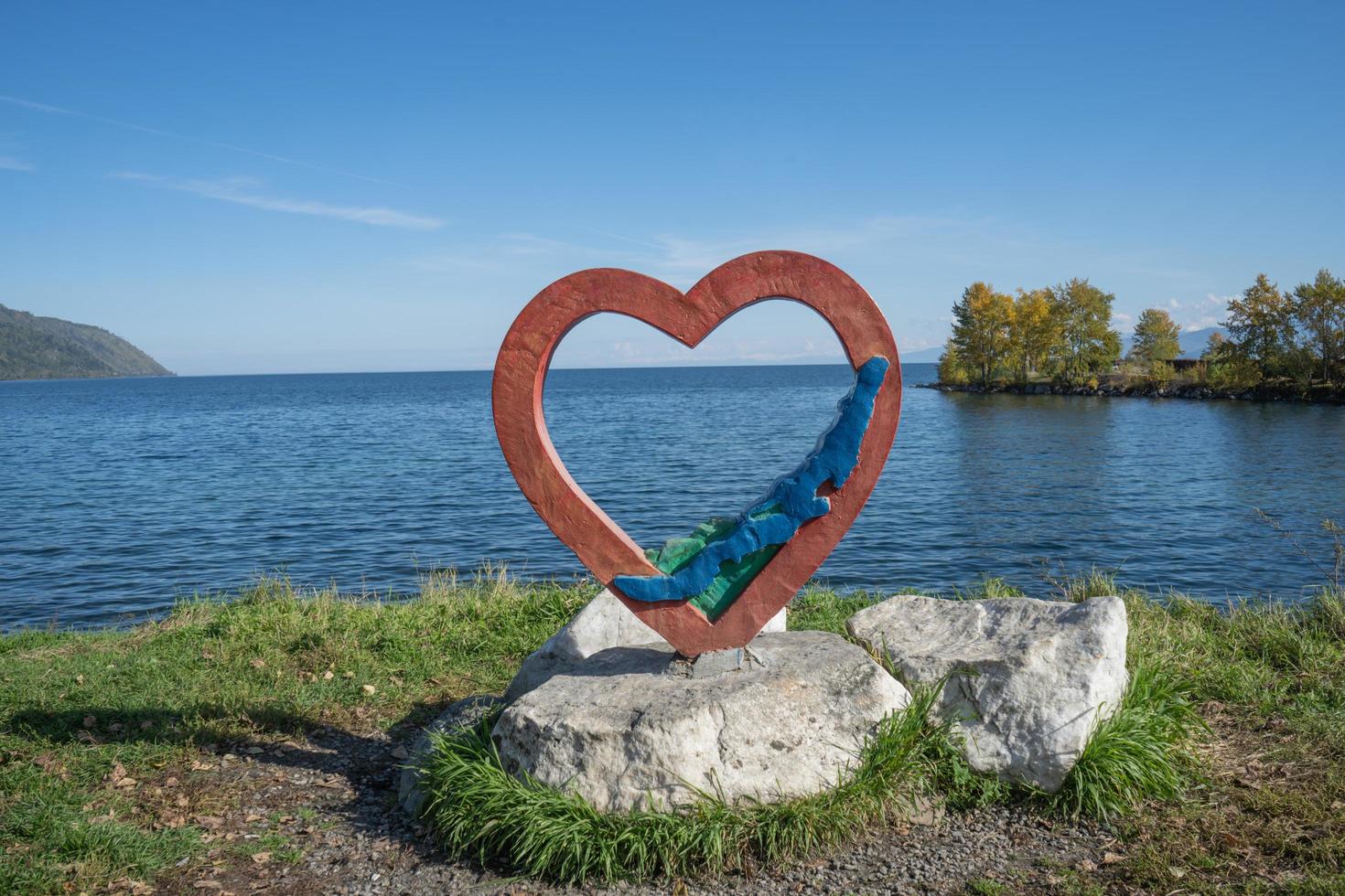 Sculpture of a heart on the shore of Lake Baikal. photo