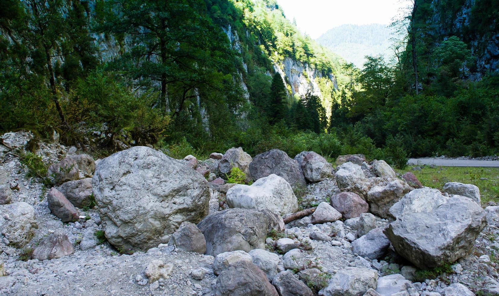 Mountain landscape with big stones on the road photo