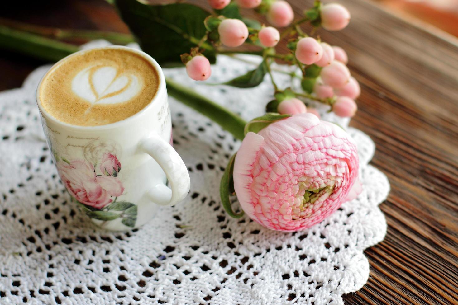 Flowers and cappuccino photo