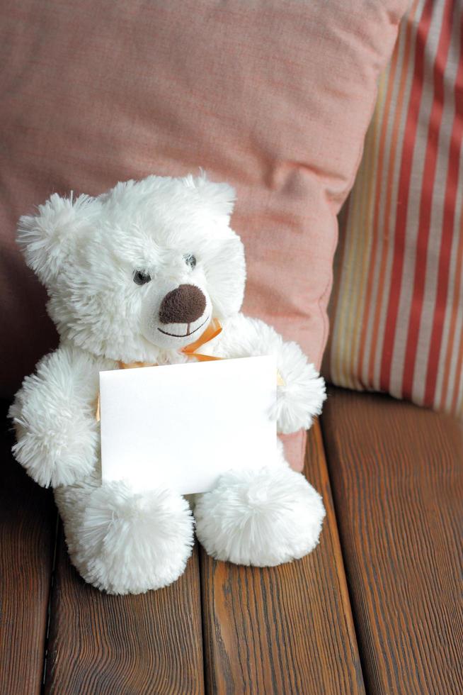 White teddy bear and blank card photo