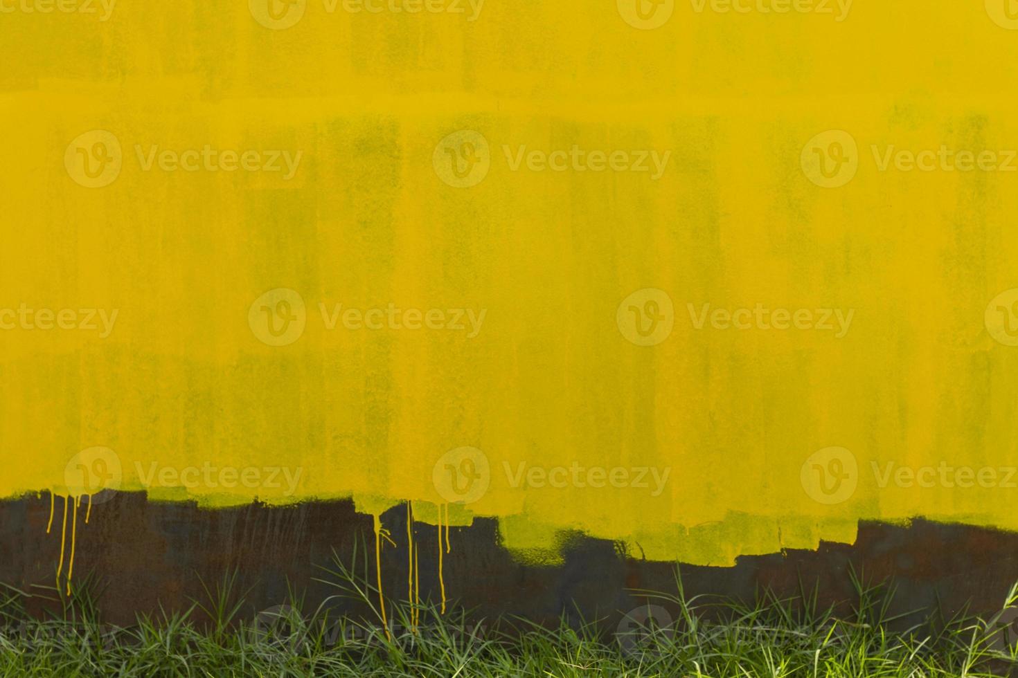 Rusty metallic wall background with yellow old paint photo