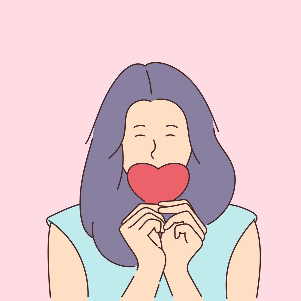 Love story or Valentines day concept. Young smiling girl covers her mouth with a paper red heart. vector