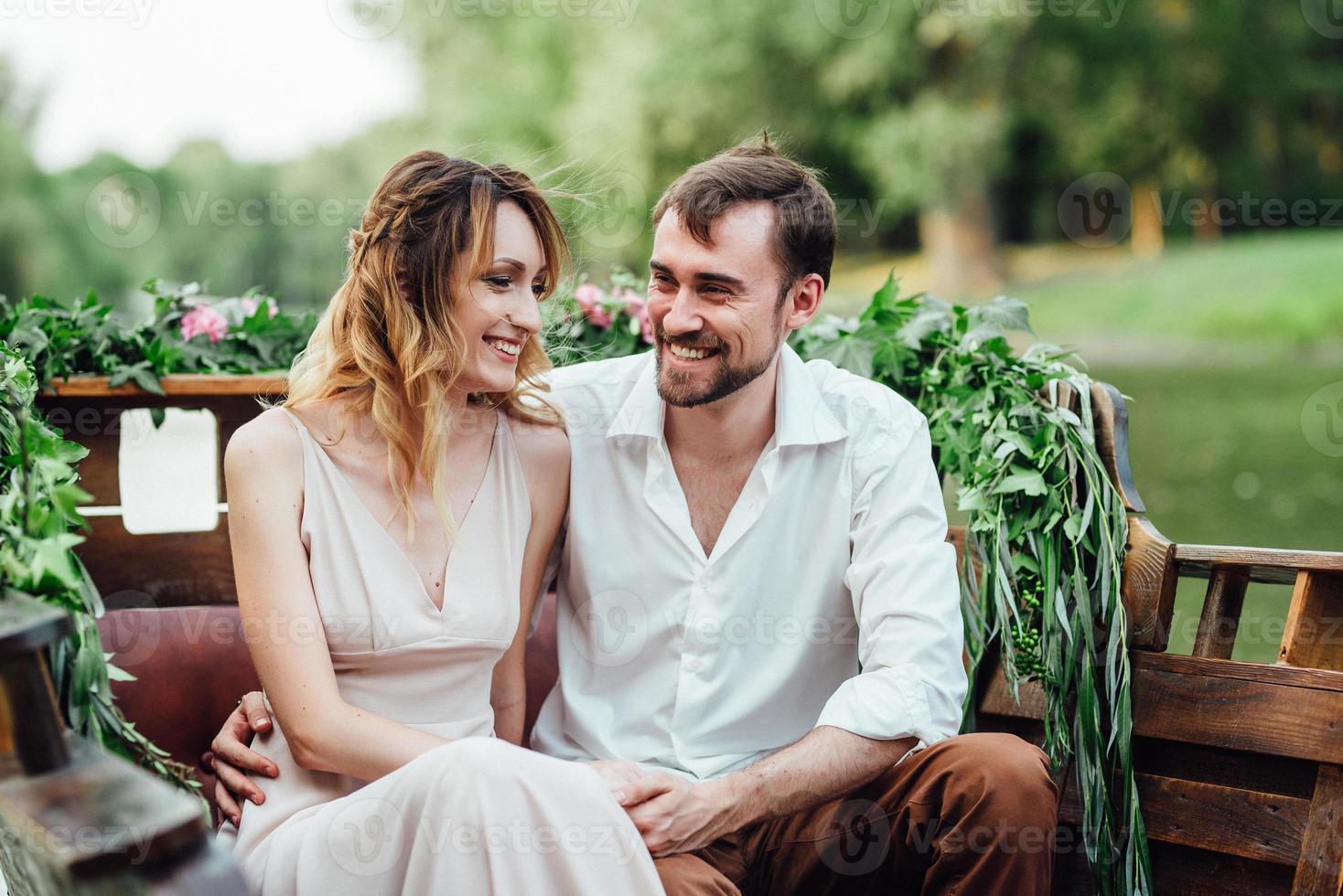 A boat trip for a guy and a girl along the canals and bays of the river photo