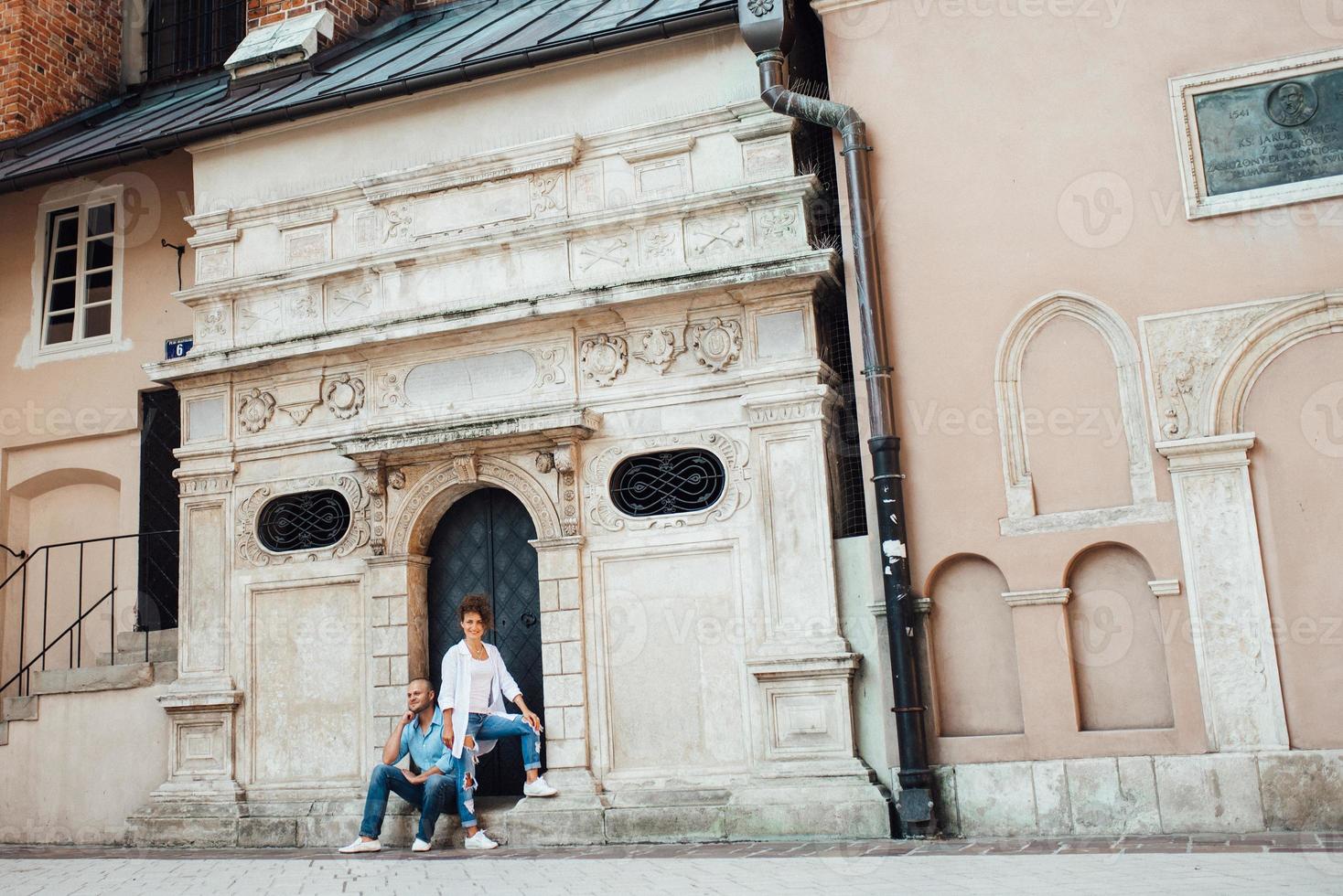 Guy and a girl happily walk in the morning on the empty streets photo