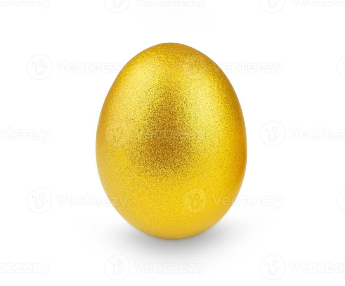 Golden egg isolated on a white background photo