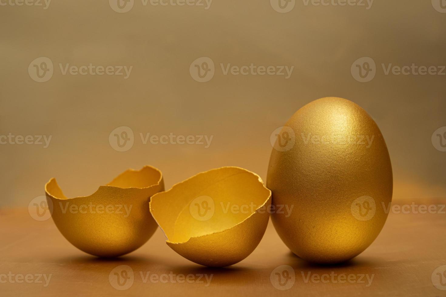 Golden egg on table photo