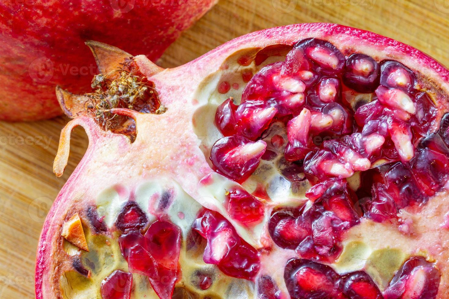 Sliced fresh pomegranate macro capture suitable as background or wallpaper photo