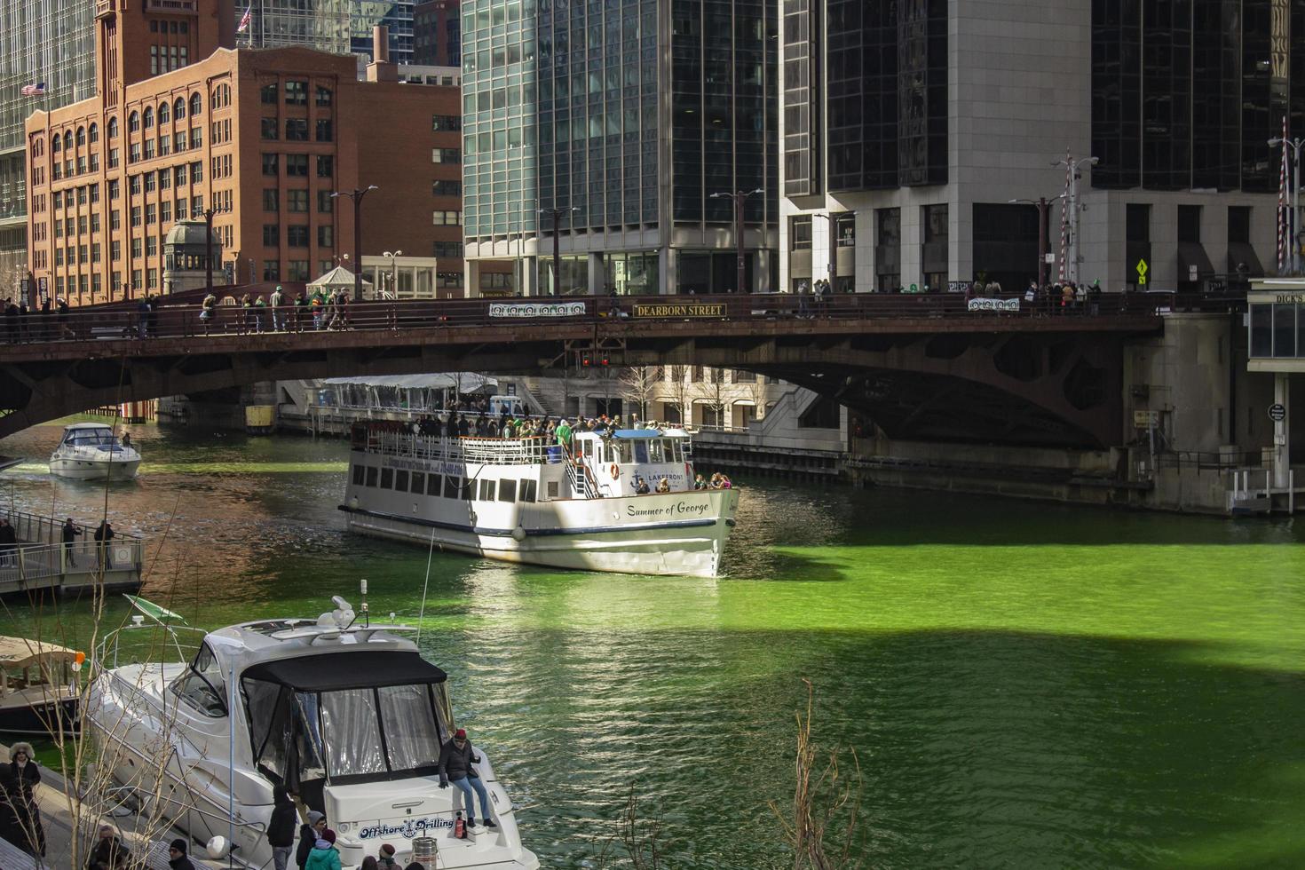 Chicago, Illinois, Mar 17, 2017 - People celebrating St Patrick's Day on the green river photo