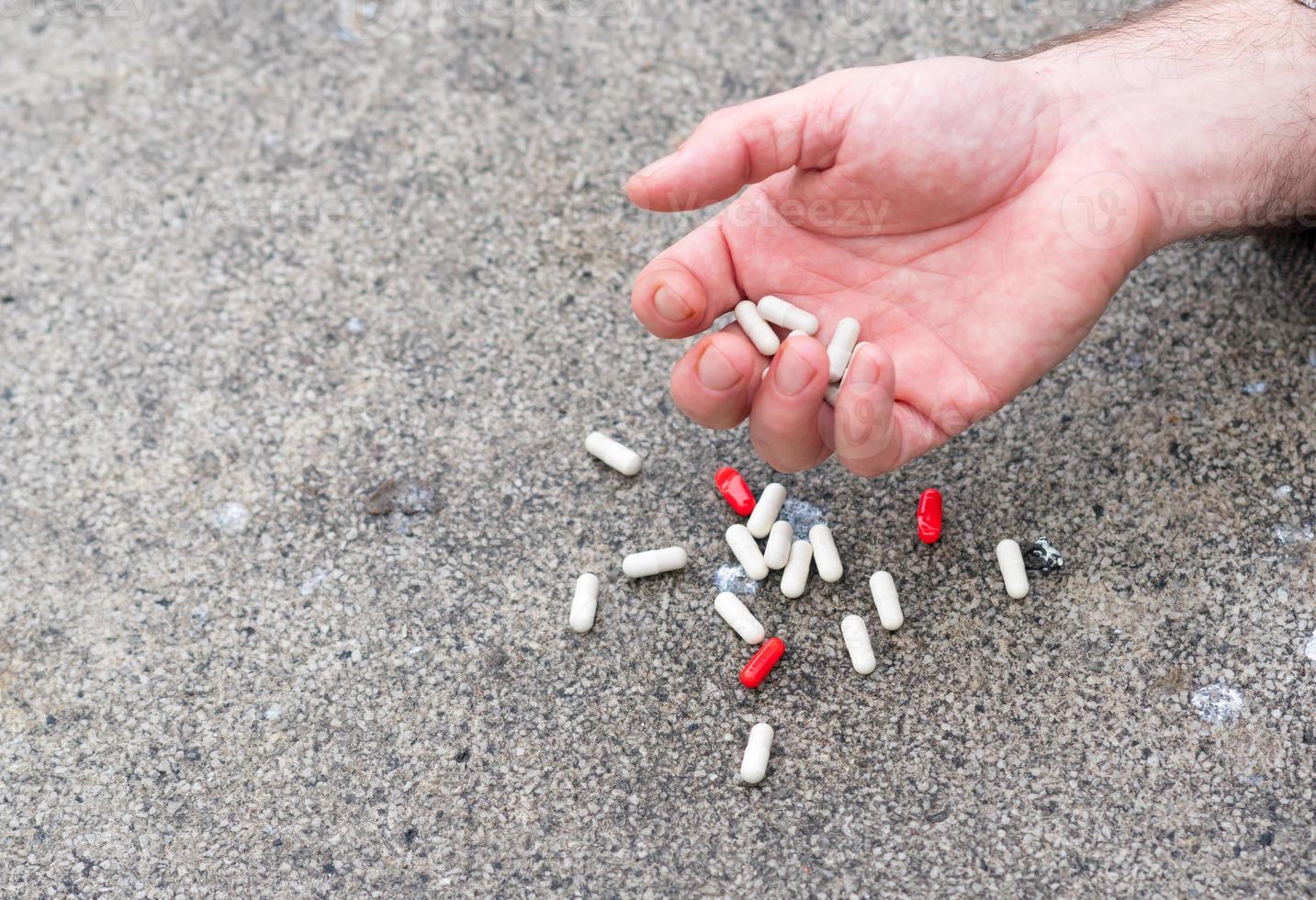 Hand holding medical tablets photo