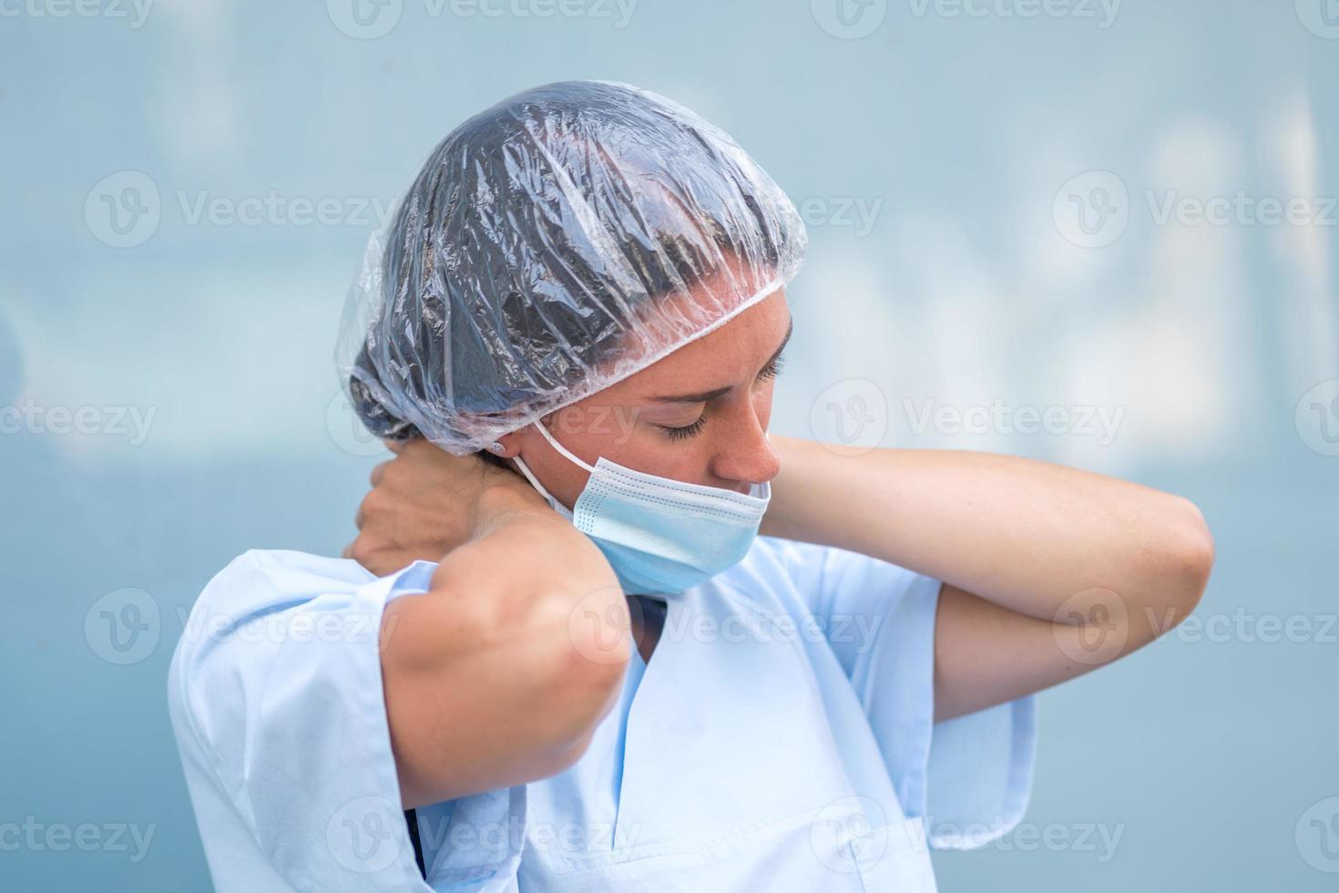 Overwhelmed nurse during her work shift photo