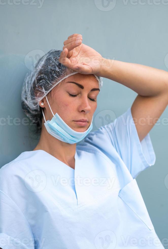 Concerned doctor resting photo