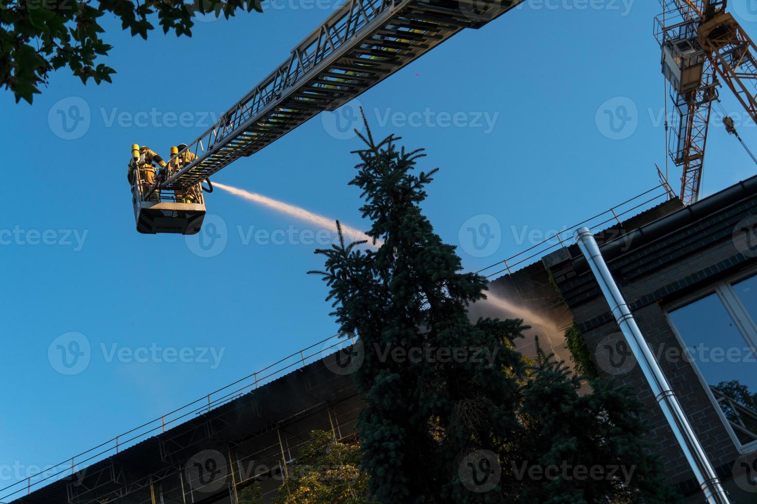 Firefighters extinguishing a blaze photo