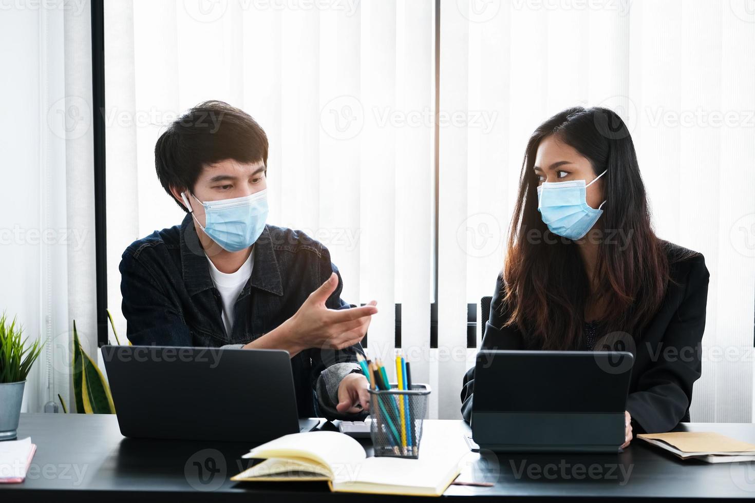 Two professionals working with masks on photo