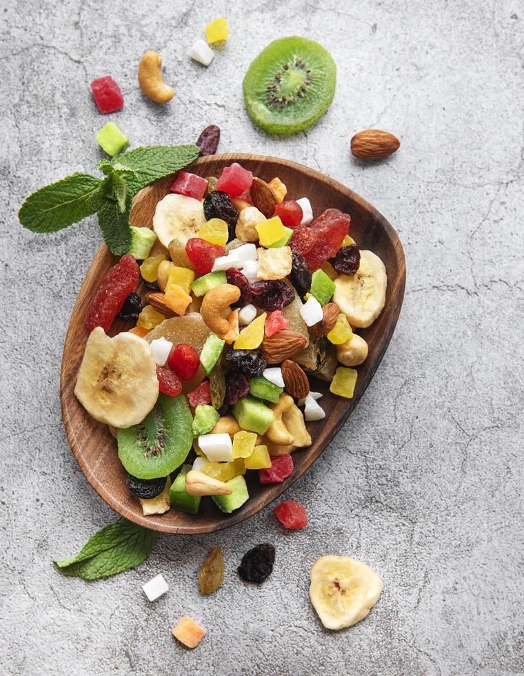 Bowl with various dried fruits and nuts photo