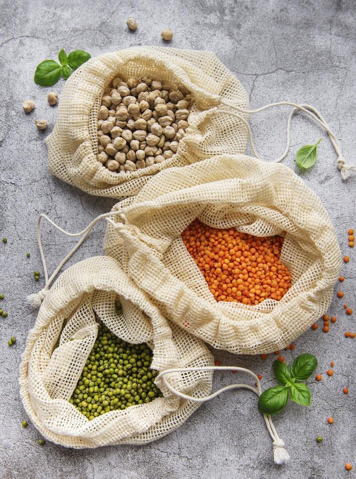 Eco bags with different types of legumes photo