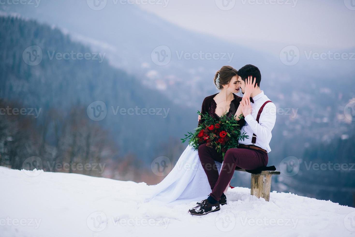 walk the groom and the bride in the Carpathian mountains photo