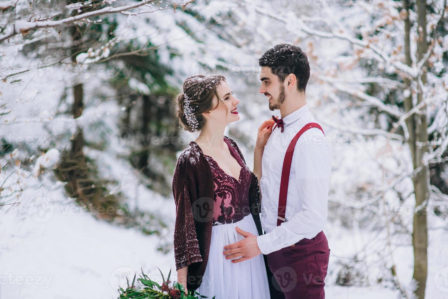 walk the groom and the bride in the Carpathian mountains photo