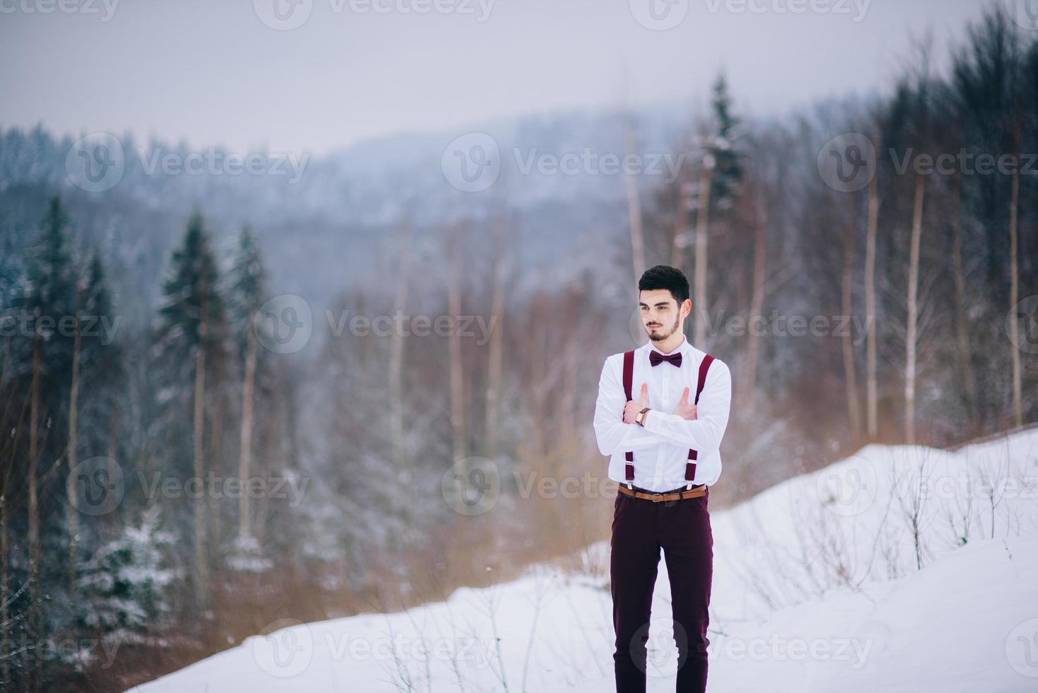 walk the groom and the bride in the Carpathian mountains photo