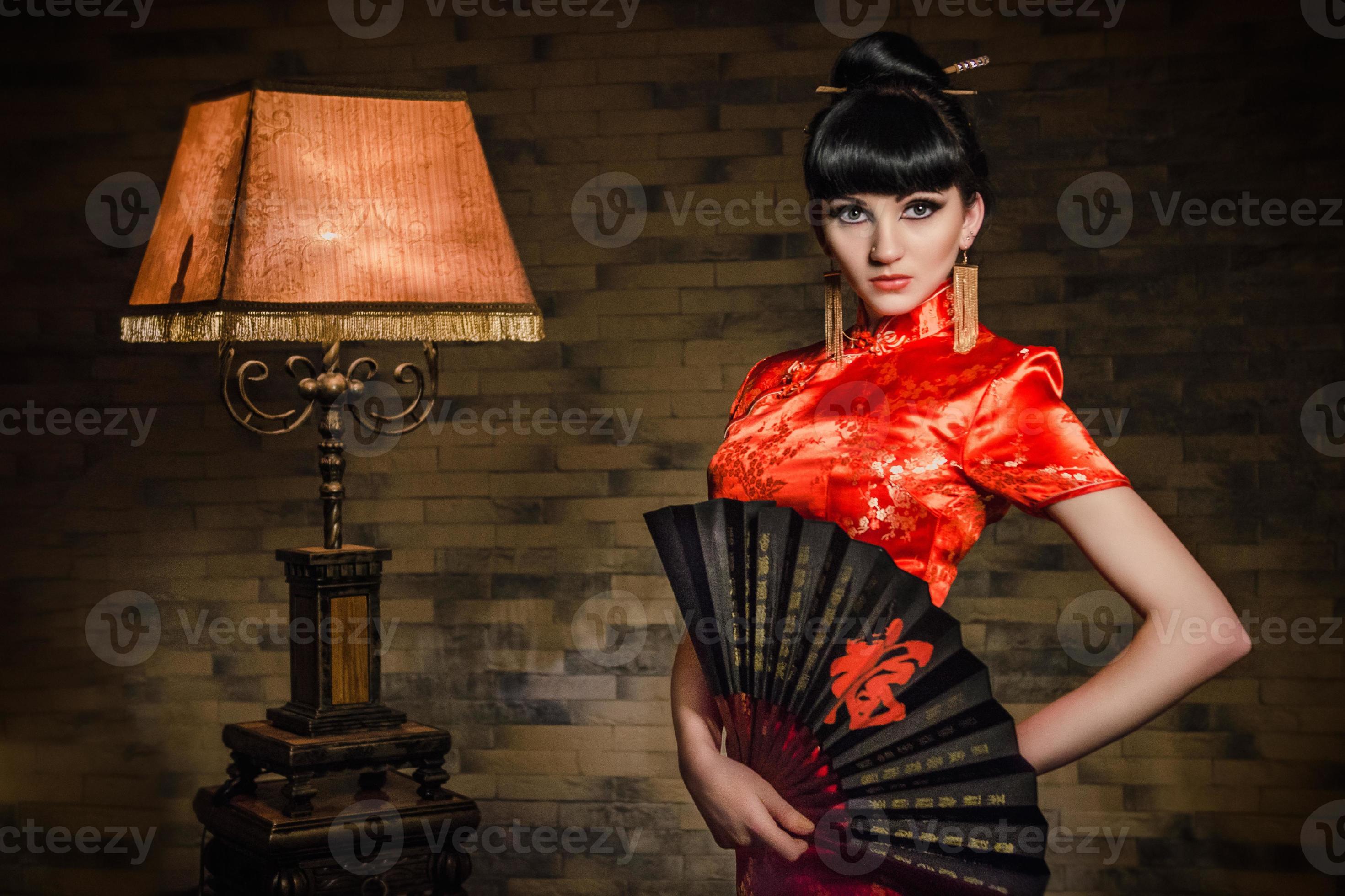 girl in a red Japanese silk dress qipao in a dark room 2376221 Stock