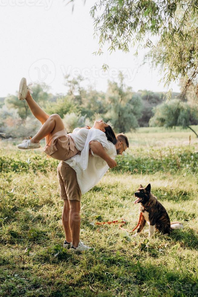 Big dog for a walk with a guy and a girl photo