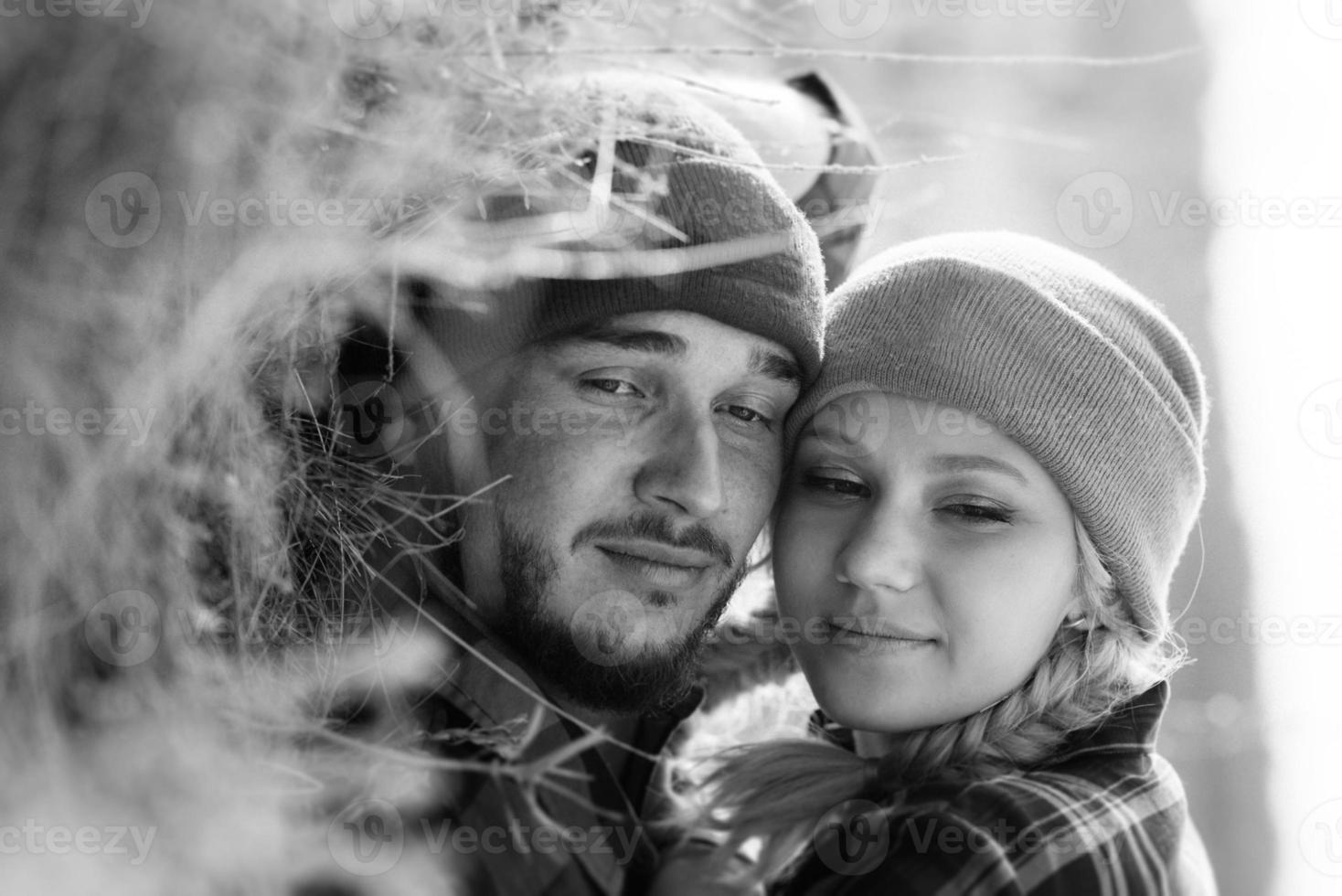 Cheerful guy and girl on a walk in bright knitted hats photo