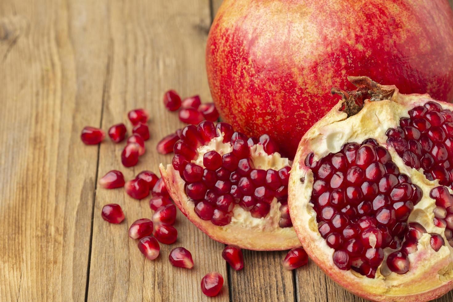 Fresh pomegranate on table photo