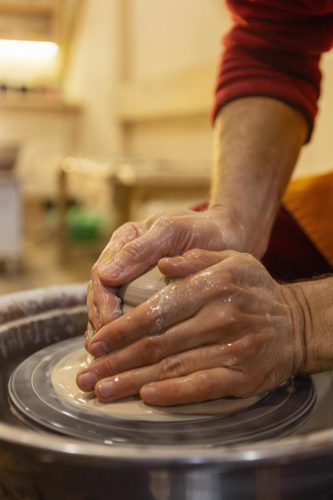 Hands making pottery photo