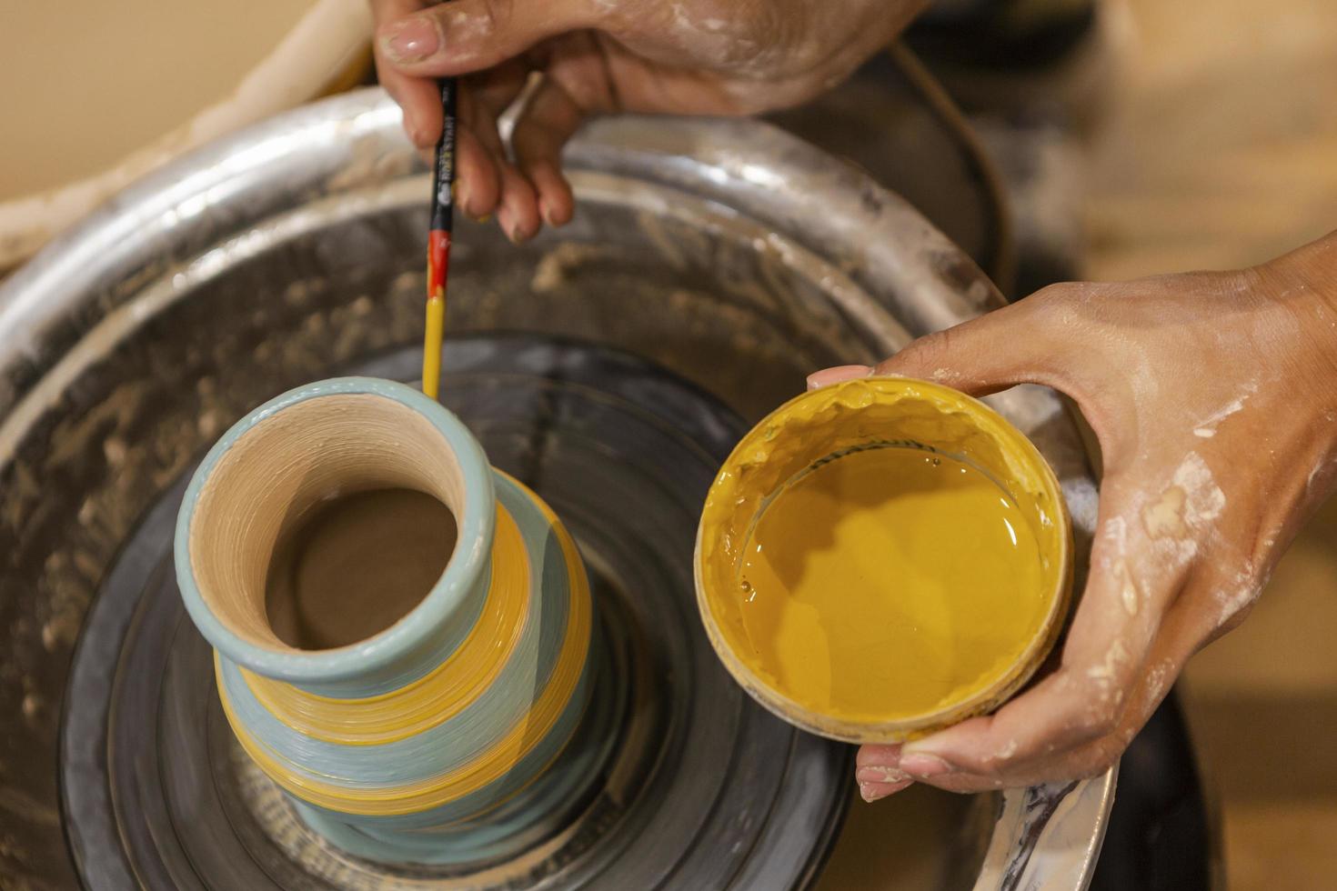 Top view of a person creating pottery photo