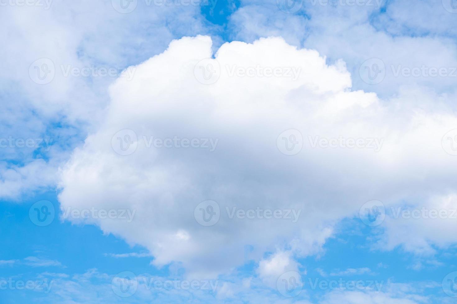 white airy porous cloud on blue sky with copy space photo