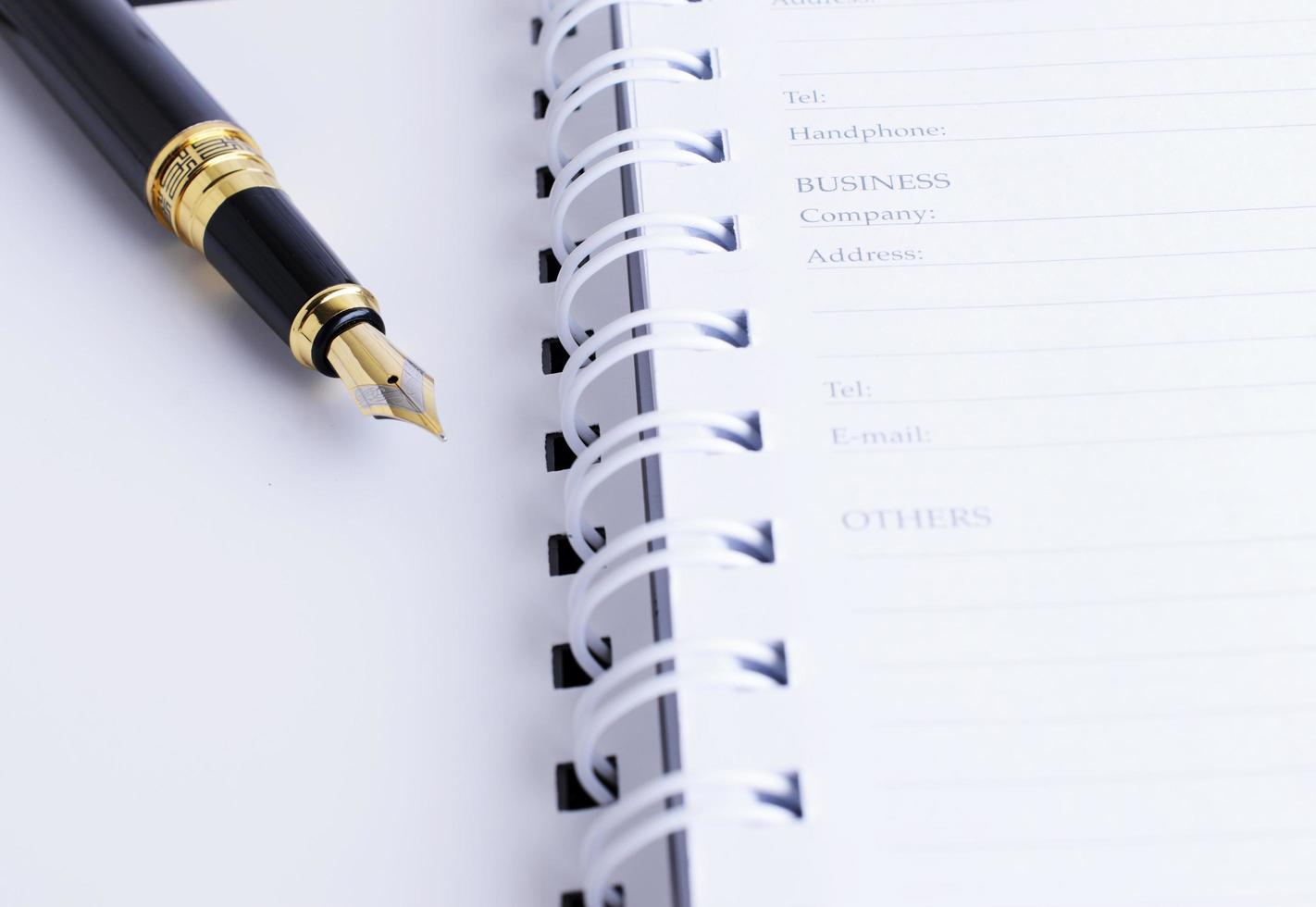 Close up of Fountain pen on Memoery personal data book photo