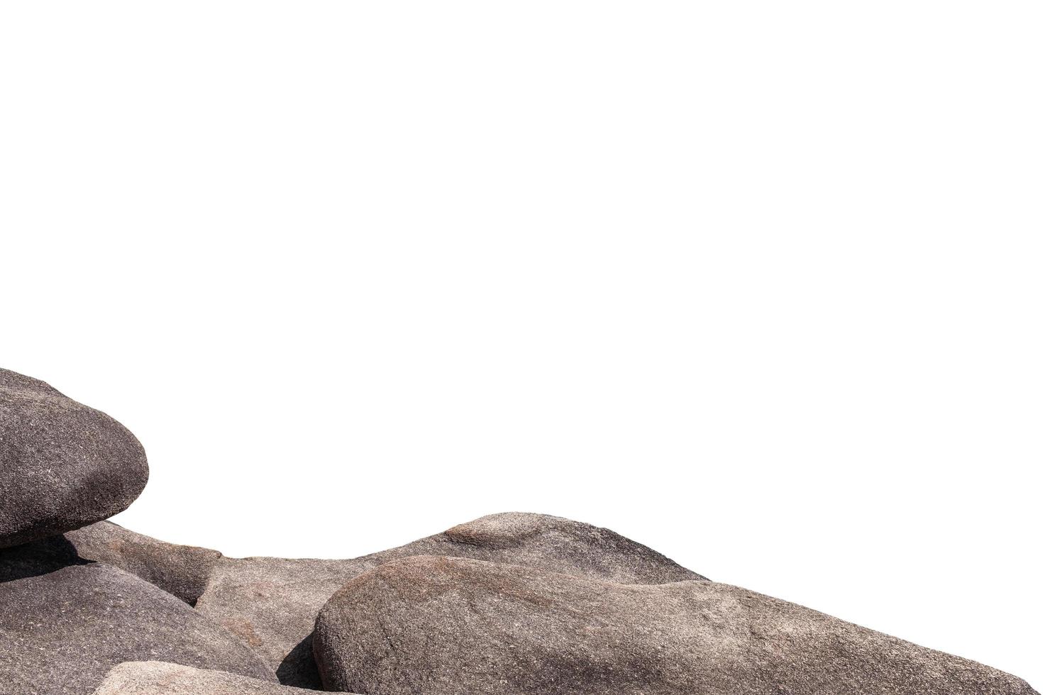 Large round rough stones stacked on background photo