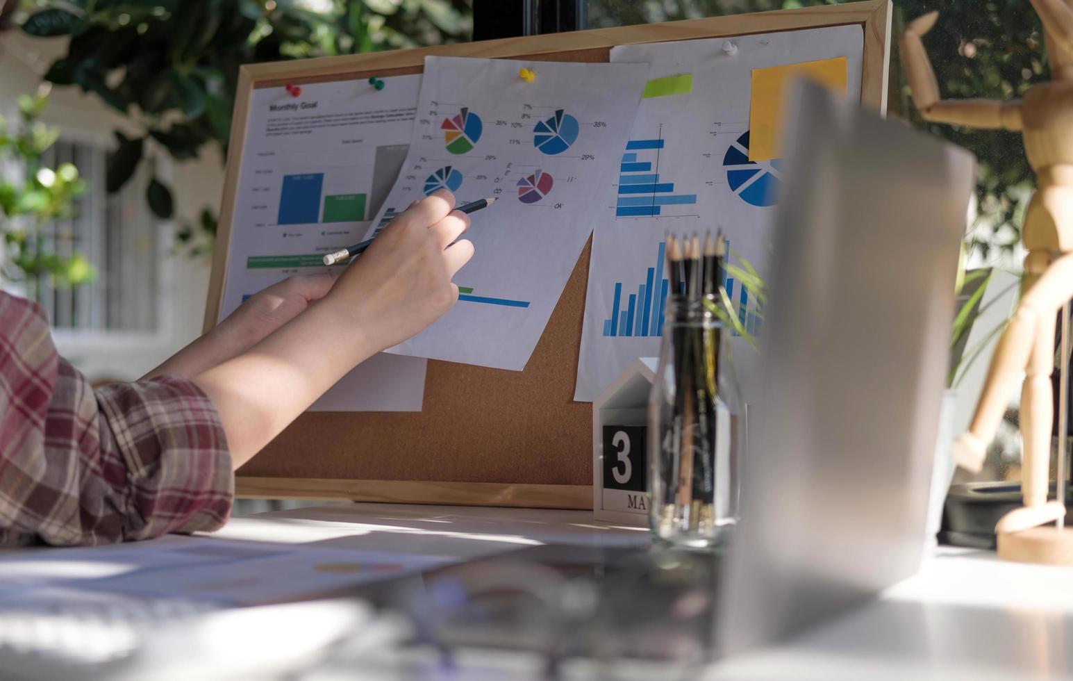 woman accountant making working audit and calculating expense financial annual financial report balance sheet statement, doing finance making notes on paper checking inspection. photo