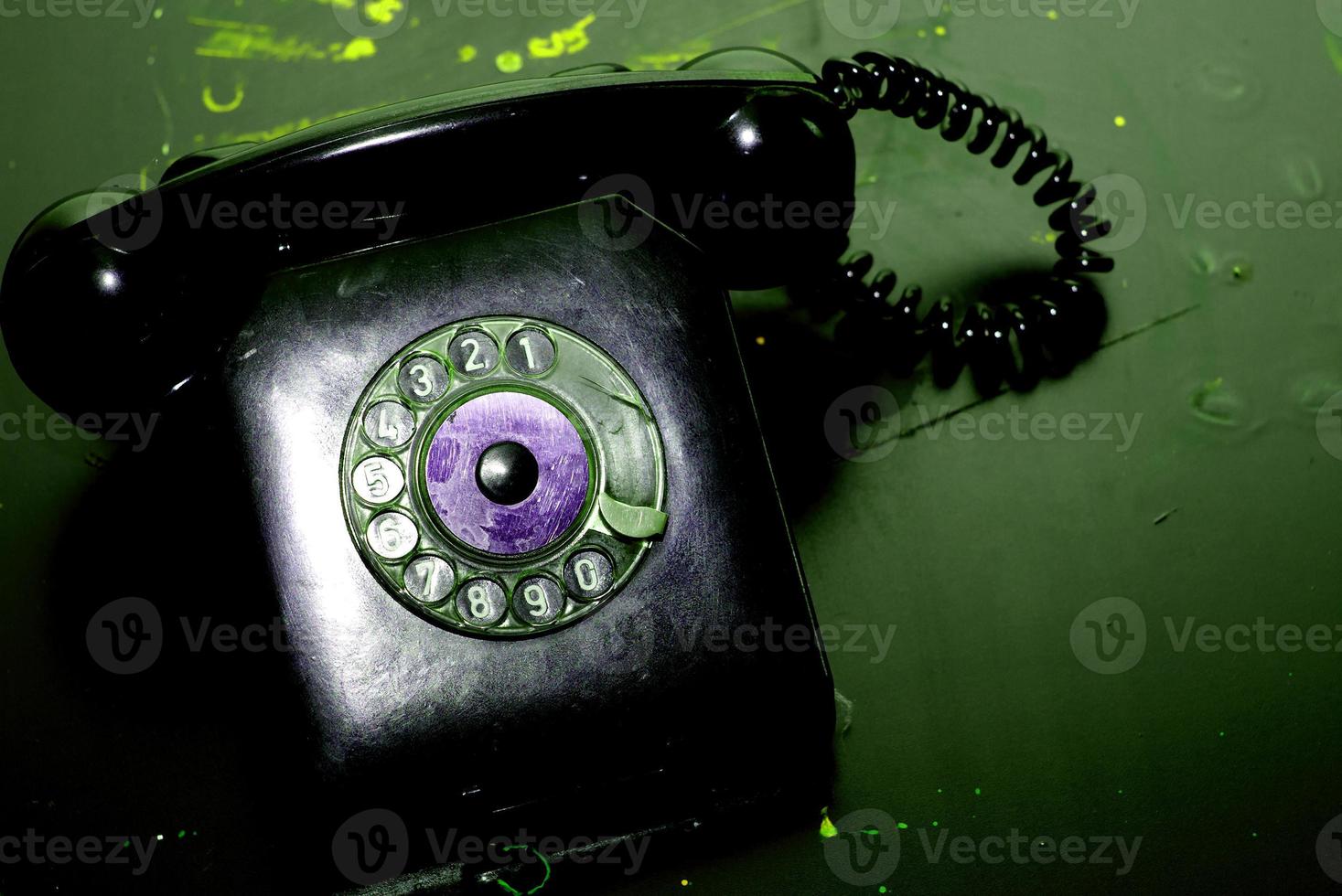Vintage landline telephone with coiled cable photo