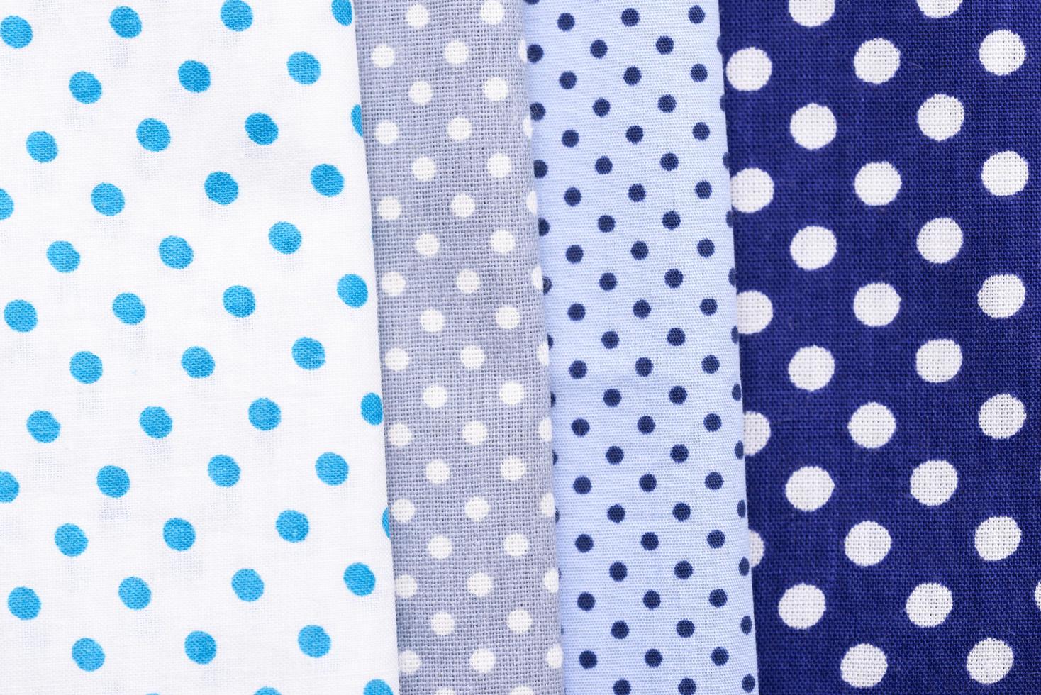 Assorted blue polka dotted fabrics photo