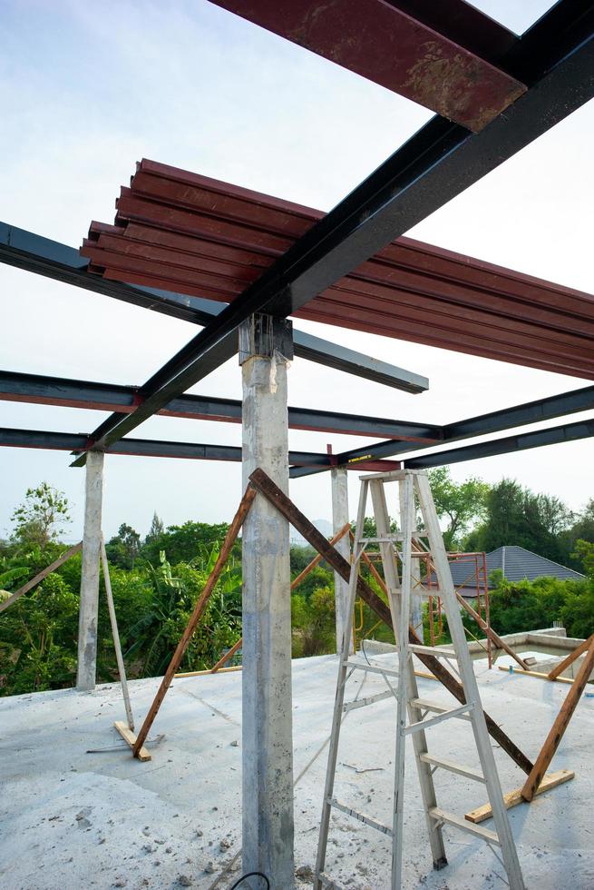 Closeup of many metal beams on the steel bar at the construction site with blue sky background photo