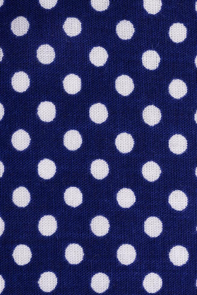 Dark blue polka dot fabric photo